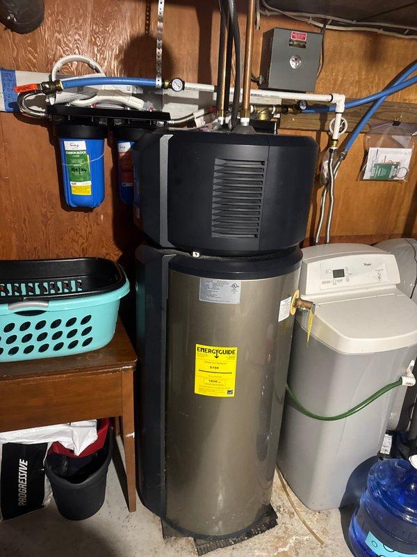 Arrived on-site during scheduled morning window to assess existing tanked water heater system and provide replacement estimate. Performed comprehensive evaluation of current water heater installation, including inspection of venting configuration, plumbing connections, electrical components, and associated utility room equipment. Documented existing system setup with detailed photographs showing the water heater, surrounding plumbing infrastructure, water treatment systems, and mechanical room layout. Prepared estimate for complete water heater replacement service.