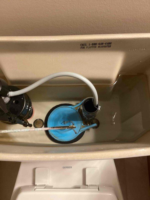 Responded to service call for master toilet that was running continuously and making periodic noise. Upon inspection, discovered the water supply tube had disconnected from the fill valve assembly and fallen into the flush valve housing, causing a siphoning effect that drained water from the tank and triggered constant refilling. Repositioned the supply tube back into its proper connection point on the fill valve, secured all components, and tested the toilet to verify proper operation and confirm the issue was fully resolved.