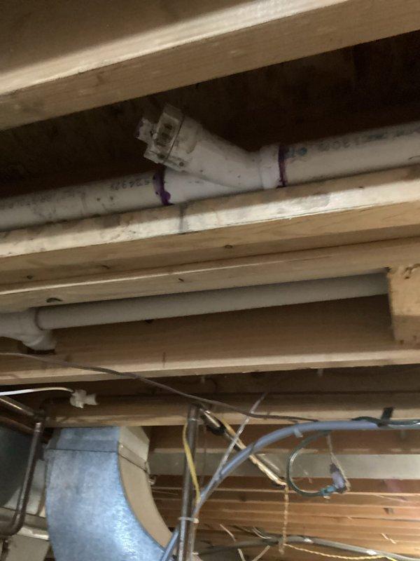 Responded to a drainage backup affecting the kitchen sink and half bathroom lavatory on a shared branch line. Attempted to clear the obstruction using a sink machine through two separate cleanout access points without success. Based on the persistent blockage and inability to clear from available access points, recommended specialized drain service for further diagnosis and clearing of the main drain line.