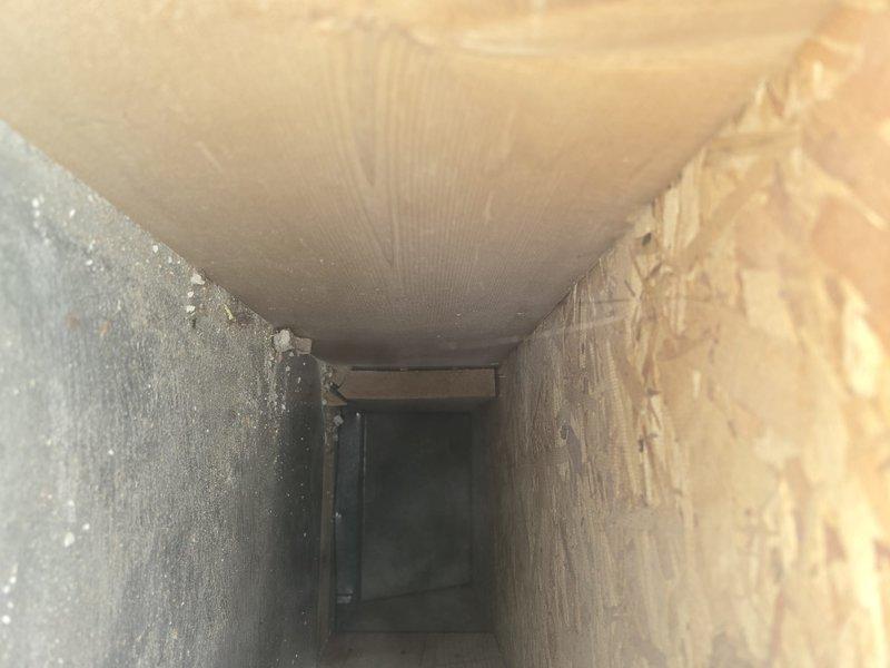 Performed comprehensive duct cleaning service in conjunction with recent HVAC installation. Removed accumulated dust and light debris from interior ductwork and ventilation passages, including corrugated metal supply ducts and wooden return air channels. Cleaned all accessible vents and registers to restore proper airflow and improve indoor air quality.