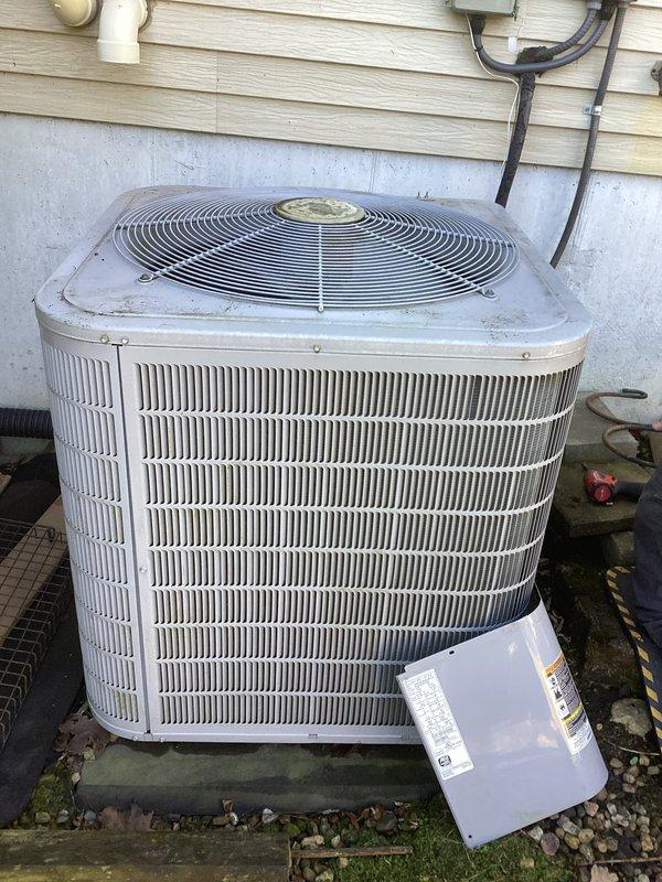 Responded to no cooling complaint on residential air conditioning system. Upon arrival, customer reported compressor not turning on and system completely dead. Performed diagnostic evaluation and found system operating normally at time of inspection. Identified energy saver device (load management box) installed on unit as likely cause of customer concern. Provided customer education on proper operation and function of energy saver box, explaining how utility company can temporarily cycle system off during peak demand periods. Confirmed system cooling capacity and normal operation. No repairs required.