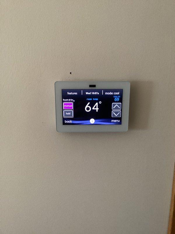 Responded to callback for no cooling condition. Upon arrival, verified thermostat settings and system operation. Found air conditioning system cycling properly with thermostat communicating correctly and calling for cooling at 69°F setpoint. System running normally with no faults detected. Advised to monitor performance and contact if issues recur.