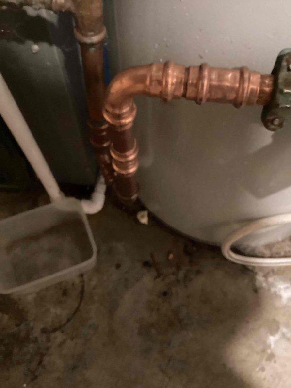 Responded to a water line leak at a residential property built in 1988. Upon arrival, located a pin hole leak on the copper water main immediately after the meter. Shut off water supply and cut out the damaged section of copper pipe and compromised fittings. Installed new copper pipe and fittings using proper soldering techniques to ensure a watertight seal. Restored water service to the home and verified all connections were secure with no additional leaks. System tested successfully with full water pressure restored to the residence.