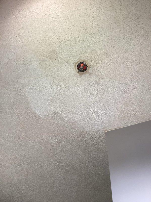 Responded to service call for light fixture installation assistance. Homeowner had removed existing fixture but was unable to complete installation of new three-arm chandelier-style fixture. Successfully mounted and hung new black chandelier fixture from ceiling, securing all electrical connections and chain support. During testing, diagnosed faulty wall switch preventing proper fixture operation. Homeowner elected to replace switch independently and will complete installation of light globes and bulbs after switch repair.