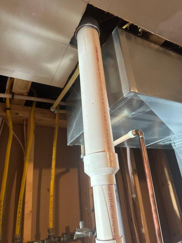 Responded to service call for leaking water heater in residential basement utility area. Upon arrival, confirmed active leak from A.O. Smith tanked water heater requiring full unit replacement. Removed failed water heater and installed new A.O. Smith residential tanked water heater unit. Connected water supply lines, installed proper venting system using PVC piping with appropriate fittings and couplings, and ensured all connections were secure and code-compliant. Verified proper integration with existing water treatment system including blue filtration tank. Tested new water heater for proper operation, confirmed no leaks at all connection points, and ensured safe venting through ceiling infrastructure. Unit operational and performing as specified upon completion.