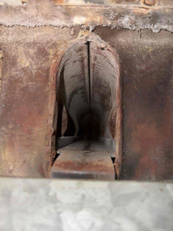 Responded to gas leak call on 39-year-old furnace unit. Upon inspection, identified gas leak at furnace gas valve and discovered extensive deterioration of heat exchanger with visible rust and cracks throughout the system. Heat exchanger showed significant corrosion and structural compromise, presenting a safety hazard for continued operation. Due to the age of the unit and severity of heat exchanger damage, unit was deemed unsafe for operation and replacement was recommended. Coordinated with office to schedule project manager for system replacement estimate.
