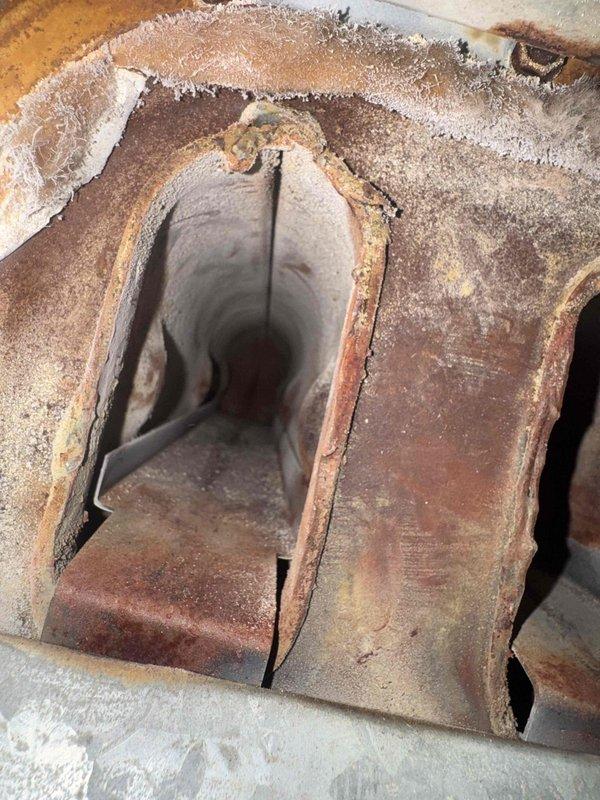 Responded to gas leak call on 39-year-old furnace unit. Upon inspection, identified gas leak at furnace gas valve and discovered extensive deterioration of heat exchanger with visible rust and cracks throughout the system. Heat exchanger showed significant corrosion and structural compromise, presenting a safety hazard for continued operation. Due to the age of the unit and severity of heat exchanger damage, unit was deemed unsafe for operation and replacement was recommended. Coordinated with office to schedule project manager for system replacement estimate.