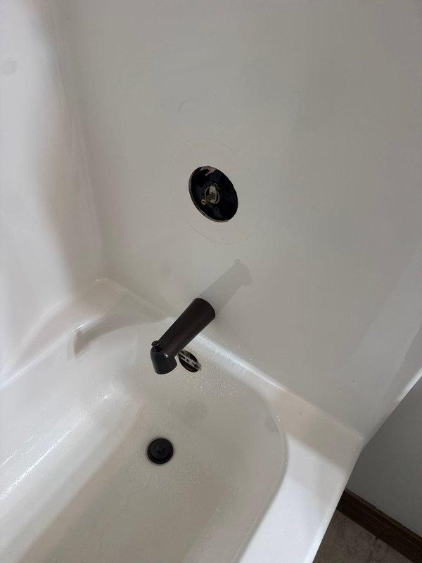 Responded to emergency call for shower valve malfunction with water continuously running and unable to shut off. Upon arrival, diagnosed faulty shower cartridge causing loss of water control. Successfully removed and replaced defective cartridge in single-handle shower control valve, restoring proper shut-off function and eliminating continuous water flow.