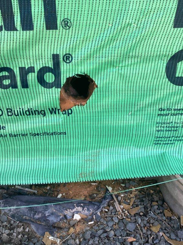 Responded to urgent service call to inspect a sealed vent on exterior wall during active siding installation. Upon arrival, identified the opening as a fresh air intake vent that had been covered by new building wrap material. Evaluated the system and determined the fresh air intake should remain accessible and operational, advising the customer accordingly before departing the site.