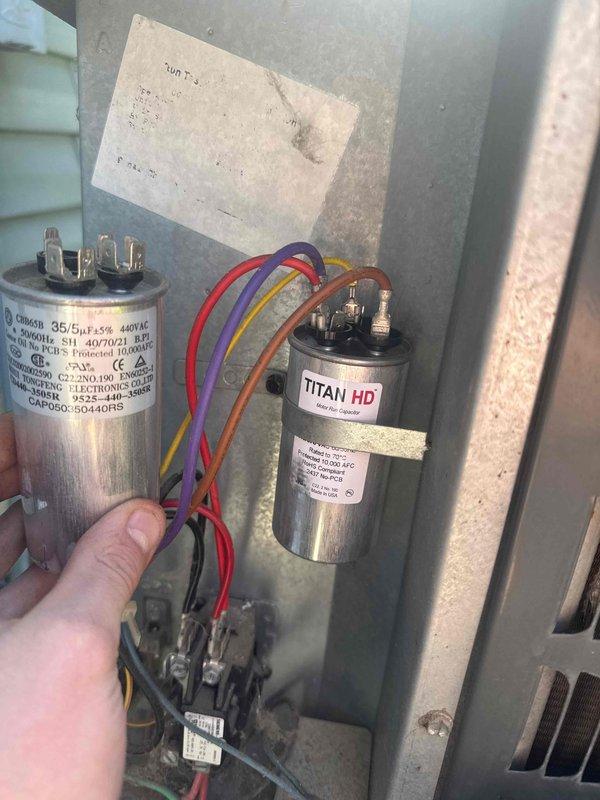 Responded to no cooling complaint on residential air conditioning system. Upon arrival, confirmed outdoor fan motor operating but indoor blower not running. Diagnosed failed dual run capacitor causing indoor blower failure. Replaced defective capacitor with new TITAN HD unit, restored system operation, and verified proper cooling performance by measuring supply and return air temperature differential.