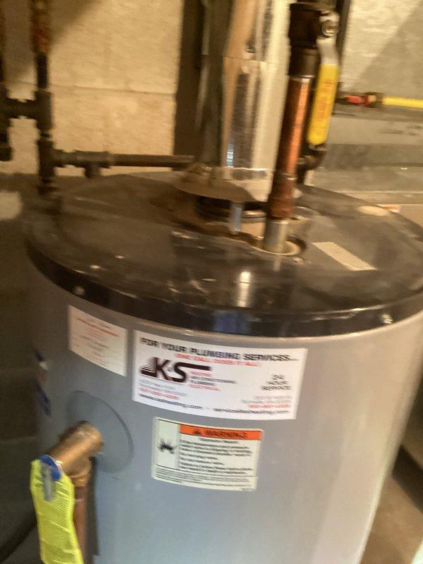 Responded to no hot water complaint and diagnosed 50-gallon atmospheric vent water heater with failed burner assembly due to corrosion, rendering unit inoperable. Inspected gas combustion system and determined burner assembly deterioration prevented proper ignition and operation. Presented repair versus replacement options, and customer elected full water heater replacement. Scheduled return visit with two-person crew to complete water heater changeout and ensure proper installation of new unit.