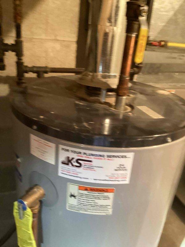 Responded to no hot water complaint and diagnosed 50-gallon atmospheric vent water heater with failed burner assembly due to corrosion, rendering unit inoperable. Inspected gas combustion system and determined burner assembly deterioration prevented proper ignition and operation. Presented repair versus replacement options, and customer elected full water heater replacement. Scheduled return visit with two-person crew to complete water heater changeout and ensure proper installation of new unit.