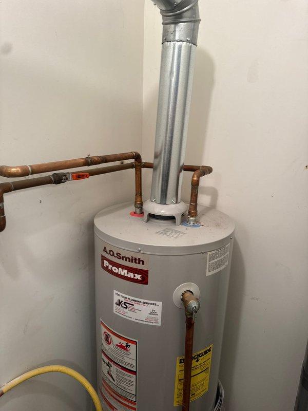 Responded to service call for leaking water heater. Upon arrival, confirmed active leak from tank requiring full unit replacement. Removed existing failed water heater and installed new A.O. Smith ProMax tanked water heater. Connected copper water supply lines, installed new flexible gas line with shut-off valve, and properly vented unit with metallic flue pipe. Tested all connections for leaks, verified proper gas flow and combustion, and ensured system operational before departure.