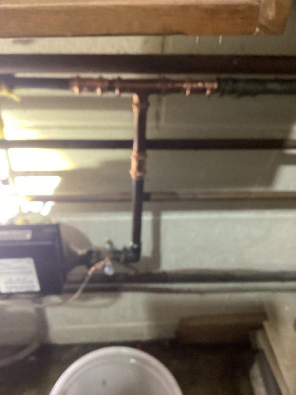 Responded to emergency call for pinhole leak in residential copper water line. Located leak on 1/2" copper water main immediately downstream of the water meter. Shut off water supply and removed damaged section of pipe and compromised fitting. Installed new copper pipe and fittings to code specifications. Restored water service to the residence and verified all plumbing systems were functioning properly with no additional leaks detected.