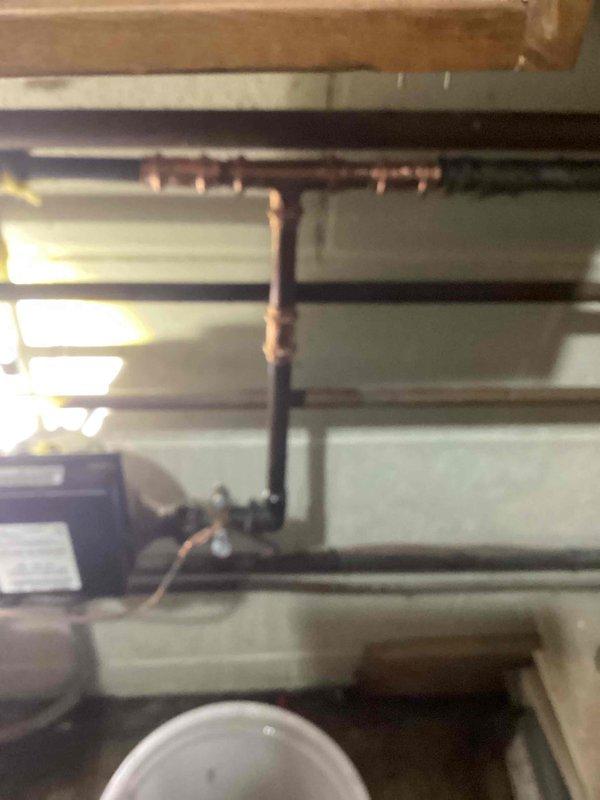 Responded to emergency call for pinhole leak in residential copper water line. Located leak on 1/2" copper water main immediately downstream of the water meter. Shut off water supply and removed damaged section of pipe and compromised fitting. Installed new copper pipe and fittings to code specifications. Restored water service to the residence and verified all plumbing systems were functioning properly with no additional leaks detected.