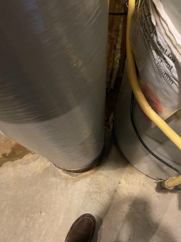 Responded to service call for leaking water heater in residential utility area. Upon arrival, performed visual inspection and confirmed active water leak originating from the tank itself, with visible water accumulation on concrete floor beneath unit. Determined tank failure was beyond repair and recommended complete water heater replacement to prevent further water damage and restore hot water service to the property.