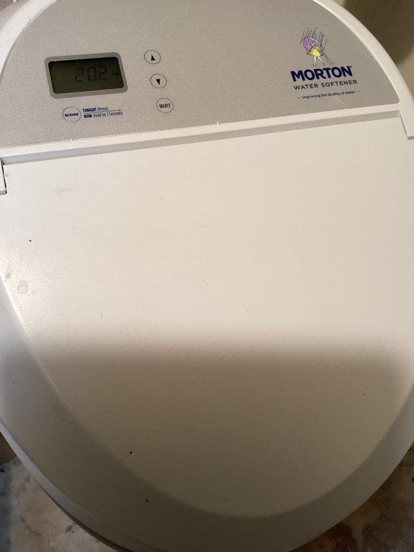Responded to service call for non-functioning Morton water softener system. Upon inspection, diagnosed control board failure preventing unit operation. Provided customer with replacement estimate and documented equipment condition with photographs.