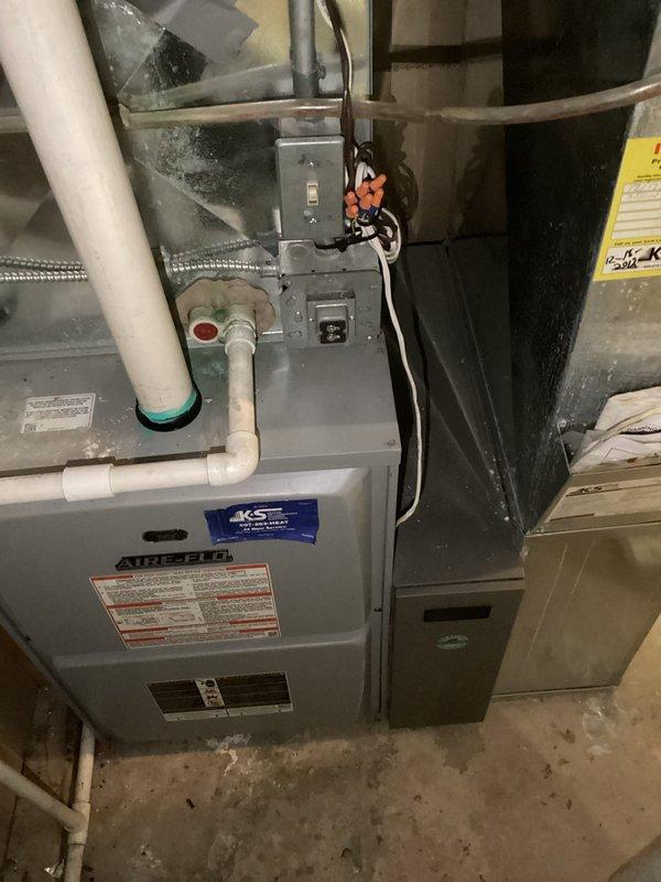 Responded to service call for Aprilaire whole-house humidifier with blinking indicator light. Performed humidifier maintenance by replacing water panel filter pad. Tested system operation to verify proper functionality and confirmed humidifier was operating correctly upon completion.
