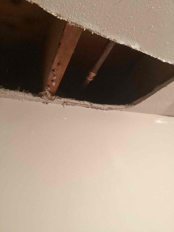 Responded to a call for a leaking hose bibb that was bursting and leaking when in use. Upon inspection, confirmed the hose bibb was damaged and actively leaking when turned on. Accessed the fixture through the ceiling, removed the failed hose bibb, and installed a new replacement unit. Tested the new installation by running water through the faucet and verified no leaks were present, restoring full functionality to the outdoor water supply.