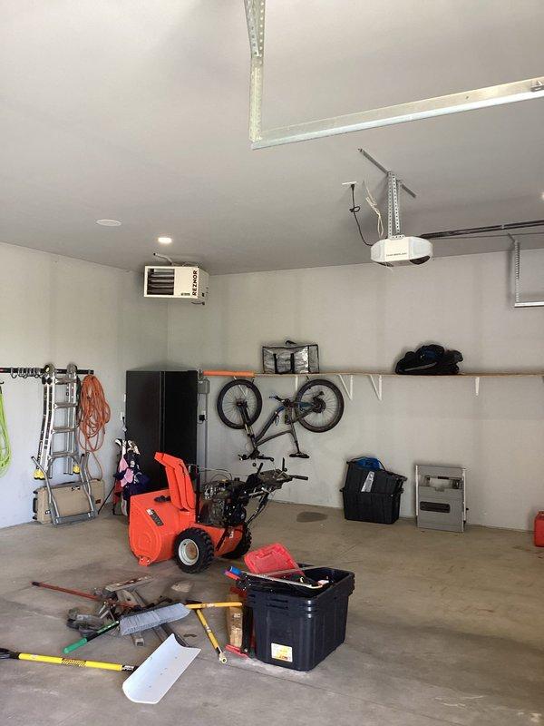 Performed on-site evaluation for electric vehicle charger installation in residential garage. Assessed existing electrical service and meter configuration to provide estimate for dedicated EV charging circuit with separate utility meter to enable off-peak charging rates. Documented current electrical infrastructure including main meter installation and garage interior layout to determine optimal routing and equipment requirements for proposed installation.