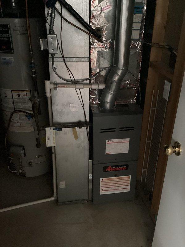 Responded to service call for Amana furnace reported to be continuously running and not shutting off when reaching set temperature. Upon arrival, performed diagnostic inspection of furnace operation, thermostat communication, and control board functionality. Removed access panel and inspected internal components including blower motor, electrical connections, and control systems. Attempted to recreate the reported issue through multiple heating cycles but was unable to duplicate the malfunction during service visit. All components appeared to be functioning within normal parameters at time of inspection. Advised homeowner that if the continuous running issue persists, thermostat replacement should be considered as the likely source of the problem, as intermittent thermostat communication failures can cause the symptoms described.