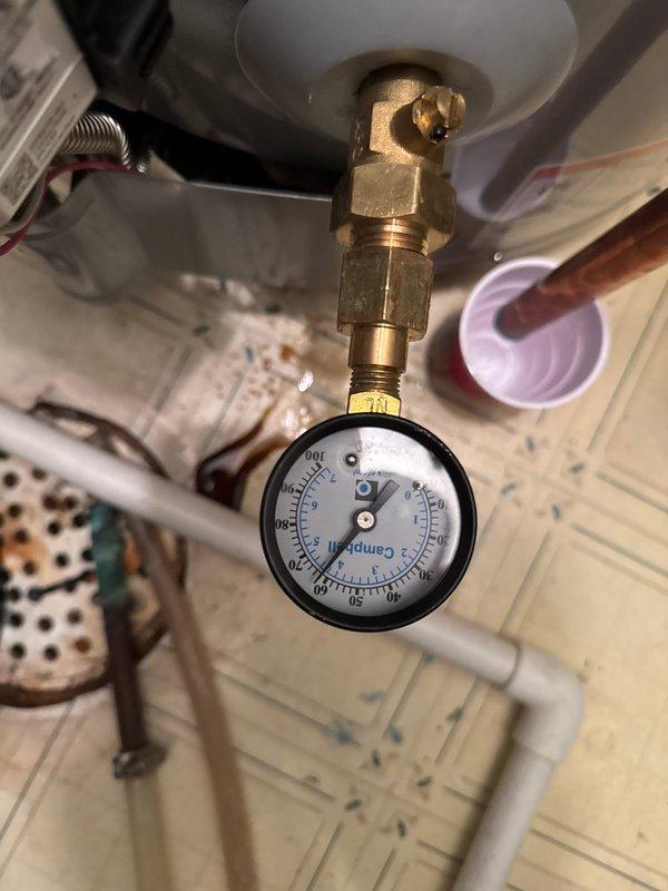 Responded to service call for leaking water heater at A.O. Smith tanked unit installed three years prior. Upon arrival, identified leak originating from temperature and pressure (T&P) relief valve. Repaired faulty T&P valve, restoring proper function and eliminating water discharge. Verified system pressure within normal operating range using gauge readings and confirmed no additional leaks present upon completion.
