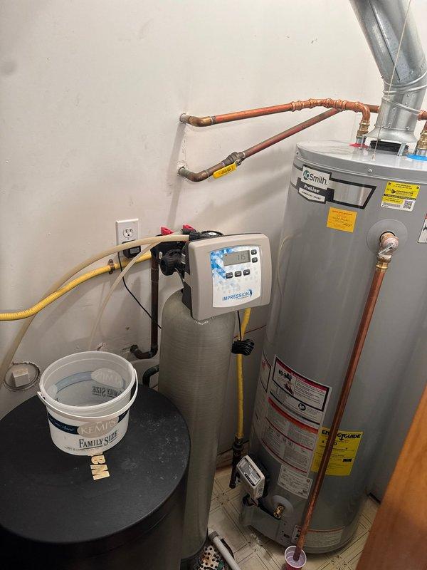 Responded to service call for leaking water heater at A.O. Smith tanked unit installed three years prior. Upon arrival, identified leak originating from temperature and pressure (T&P) relief valve. Repaired faulty T&P valve, restoring proper function and eliminating water discharge. Verified system pressure within normal operating range using gauge readings and confirmed no additional leaks present upon completion.