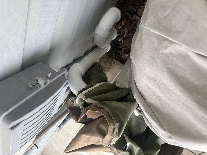 Responded to no heat call on Lennox furnace installed 10 months prior with blinking red light error code. Upon inspection, discovered patio umbrella cover had been placed over or blocking the outdoor exhaust termination pipe. Relocated the cover away from PVC exhaust piping to restore proper venting and unit operation.
