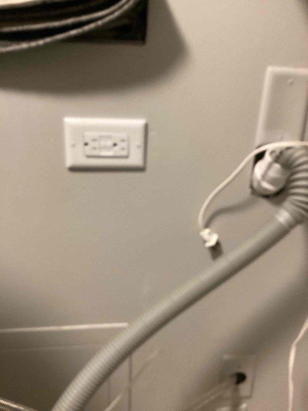 Completed electrical work per inspection estimate including installation of whole-house surge protector with tandem breaker in main panel, GFCI outlet for washing machine compliance, and stacker unit switch. All installations tested and verified operational with proper ground fault protection confirmed on GFCI receptacle.