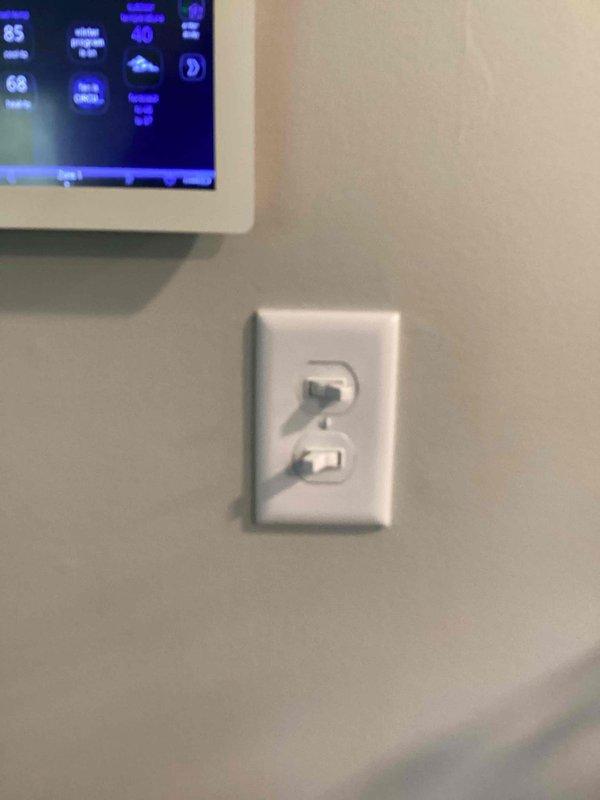 Completed electrical work per inspection estimate including installation of whole-house surge protector with tandem breaker in main panel, GFCI outlet for washing machine compliance, and stacker unit switch. All installations tested and verified operational with proper ground fault protection confirmed on GFCI receptacle.