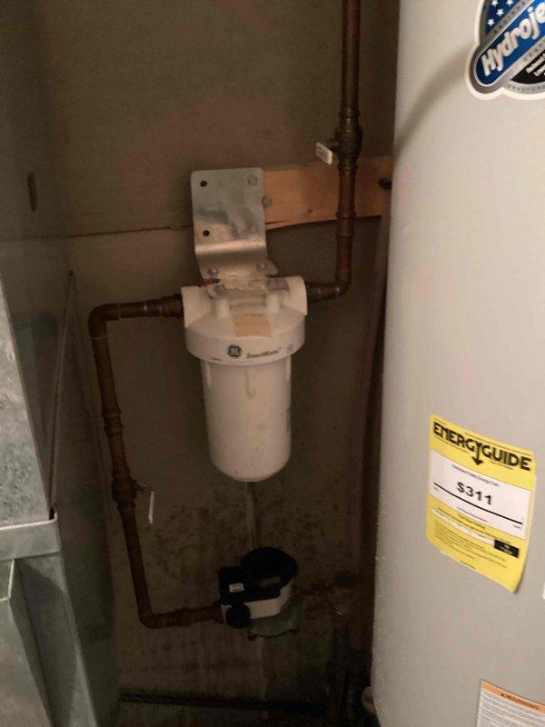 Responded to service call for low water pressure affecting entire home. Upon inspection, identified whole house water filter as source of issue. Filter was severely clogged with sediment and debris, having not been serviced in over a year. Removed old filter cartridge and installed new replacement filter. Tested system after installation and confirmed full water pressure restoration throughout the residence.