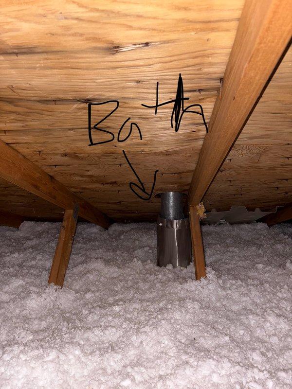 Responded to service call for reported moisture around bathroom fan vent. Upon inspection in attic space, determined bathroom exhaust fan was functioning and venting properly. Investigation revealed moisture issue was not related to bath fan ductwork but instead originated from the adjacent sewer gas vent pipe. Documented findings with photos showing attic conditions, insulation, and location of plumbing vent in relation to bathroom fan exhaust. Contacted property owner to report findings and recommend follow-up with plumbing contractor to address sewer vent issue.