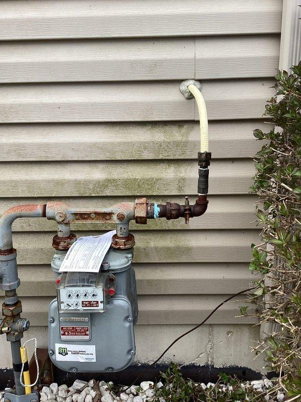 Responded to gas leak at main service line. Upon arrival, utility company had already marked the leak location at the gas meter assembly. Inspected the exterior gas meter installation and identified leak at the main gas line connection. Performed necessary repairs to eliminate the leak at the gas main. Verified system integrity and confirmed no further leaks present upon completion.