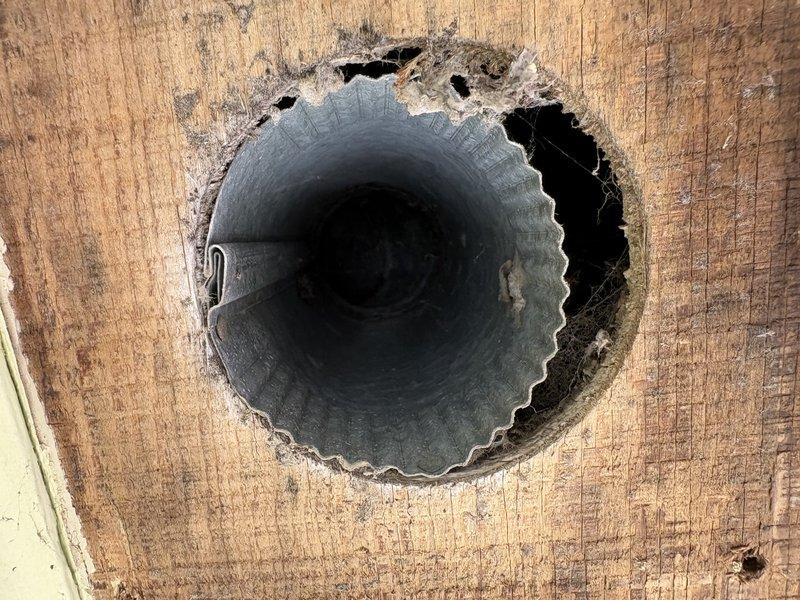 Arrived on-site at 10:00 AM to investigate bathroom exhaust fan venting concerns. Coordinated with realtor to gain property access. Located bathroom exhaust fan duct routing, which was concealed beneath attic insulation. Traced ventilation pathway from interior termination point through attic space to roof penetration. Inspected ductwork condition, connections, and proper venting configuration. Documented findings with photographs showing interior wall termination and attic duct installation.