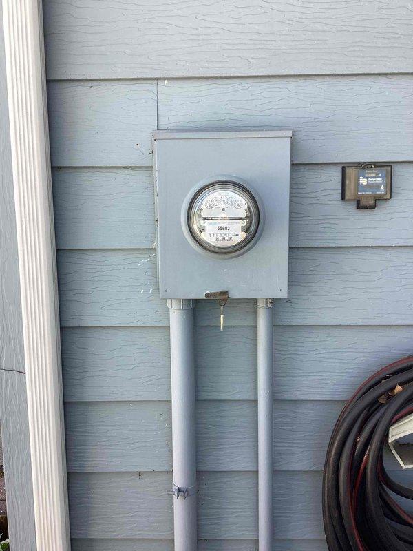 Responded to service call for power loss affecting basement and main floor bedroom circuits. Performed comprehensive electrical assessment of existing system, including inspection of outdated switches and bathroom power outlets. Evaluated current electrical service panel and meter assembly for potential upgrade requirements. Provided detailed estimate for complete rewiring of defective switches, restoration of power to affected circuits, and service upgrade to address capacity and safety concerns. Documented existing exterior meter installation and electrical infrastructure conditions with photographs for estimate reference.