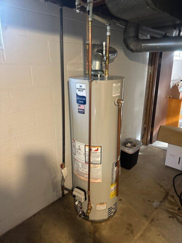 Responded to service call for non-functional water heater. Upon assessment, determined existing unit was beyond economical repair and recommended replacement. Successfully installed new 40-gallon Bradford White tanked water heater in basement utility room. Installation included proper copper piping connections, expansion tank integration, brass ball valves with shutoff capability, PVC pressure relief drain line, and all required safety components per manufacturer specifications and local plumbing codes. Tested system for proper operation, verified all connections for leaks, and ensured adequate venting. Unit operational and performing to specifications upon completion.