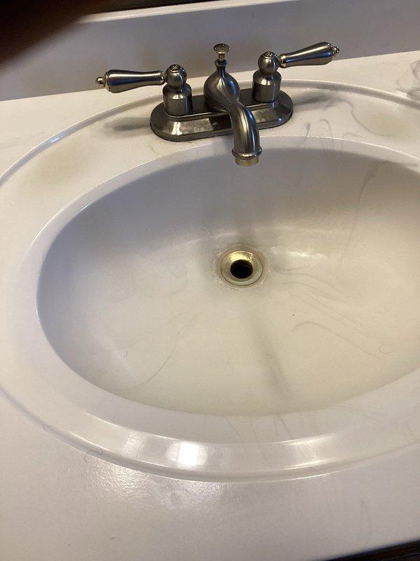 Responded to service call for corroded and leaking pop-up assembly on master bathroom lavatory faucet. Removed deteriorated pop-up drain assembly and installed new replacement unit. Tested faucet operation and verified all connections were leak-free upon completion.