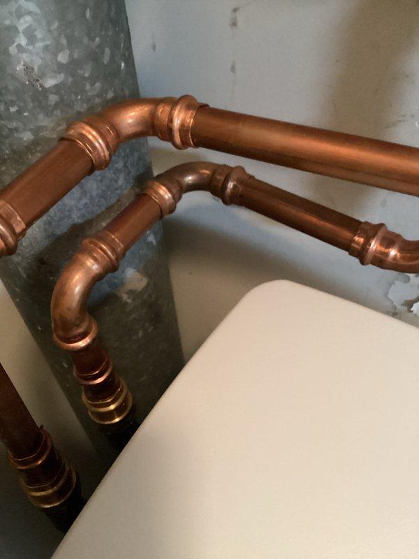 Responded to water leak emergency and located pin hole leak on copper water line in wall adjacent to water softener. Disconnected softener, created wall access to expose damaged section, and cut out compromised copper piping. Installed new copper pipe with proper soldered connections, restored water service to home, and verified system integrity with no additional leaks detected.