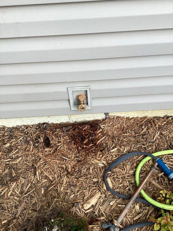 Responded to a leaking hose bibb with a faulty anti-siphon valve that could not be removed from the existing fixture. Accessed the crawl space through the basement, cut out the old hose bibb assembly, and installed a new replacement unit with proper anti-siphon protection. Restored water service to the home and verified all connections were secure and functioning without leaks.