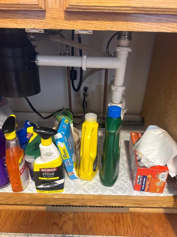 Responded to kitchen drainage issue where sink and dishwasher were not draining properly. Upon inspection, identified clog in kitchen sink line connected to garbage disposal unit. Resolved blockage by operating the disposal system, which cleared the obstruction and restored proper drainage function to both the sink and dishwasher.
