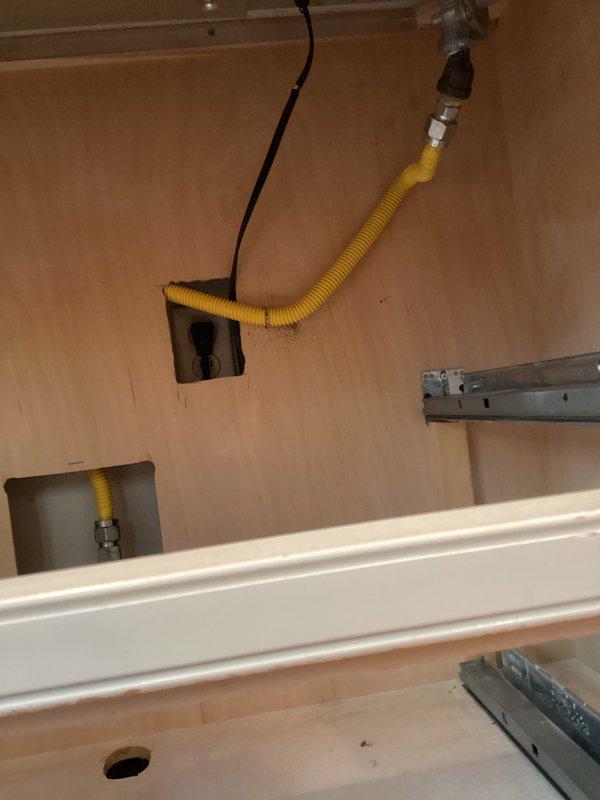 Responded to gas leak emergency at stovetop appliance. Upon arrival, identified leaking flexible gas connector (whip line) supplying the range. Shut off gas supply at isolation valve for safety. Removed defective yellow corrugated gas hose and fittings, which showed signs of deterioration at connection points. Installed new approved flexible gas connector with proper metallic fittings, ensuring secure connections at both the gas supply stub-out and appliance inlet. Performed pressure test on new installation to verify system integrity and absence of leaks. Restored gas service and confirmed proper operation of stovetop burners.
