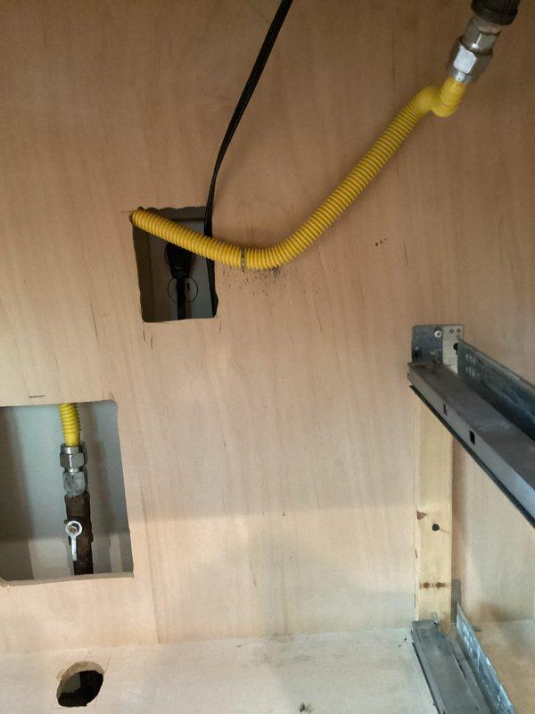 Responded to gas leak emergency at stovetop appliance. Upon arrival, identified leaking flexible gas connector (whip line) supplying the range. Shut off gas supply at isolation valve for safety. Removed defective yellow corrugated gas hose and fittings, which showed signs of deterioration at connection points. Installed new approved flexible gas connector with proper metallic fittings, ensuring secure connections at both the gas supply stub-out and appliance inlet. Performed pressure test on new installation to verify system integrity and absence of leaks. Restored gas service and confirmed proper operation of stovetop burners.