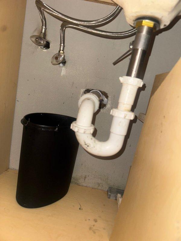 Responded to water leak in downstairs bathroom and identified failed pop-up assembly beneath sink as source of leak. Removed defective pop-up drain component and installed new replacement unit, ensuring proper seal and connection to existing P-trap assembly. Tested system for leaks and verified proper drainage function upon completion.