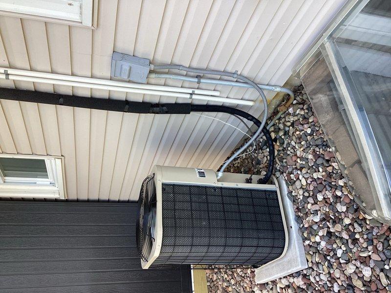 Performed comprehensive AC tune-up on residential heat pump system, replacing dirty furnace filter and completing all preventative maintenance procedures. Inspected outdoor unit with model 460LE2521 rated at 208-230V, verified proper refrigerant line connections and mounting, and confirmed all electrical specifications were within manufacturer standards. System operational and running efficiently upon completion.
