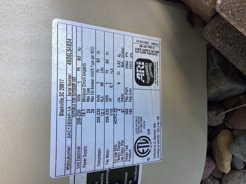 Performed comprehensive AC tune-up on residential heat pump system, replacing dirty furnace filter and completing all preventative maintenance procedures. Inspected outdoor unit with model 460LE2521 rated at 208-230V, verified proper refrigerant line connections and mounting, and confirmed all electrical specifications were within manufacturer standards. System operational and running efficiently upon completion.