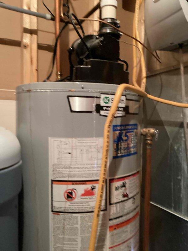 Responded to service call for water heater not producing consistent hot water. Upon arrival, performed diagnostic assessment of residential tanked water heater unit. Conducted visual inspection of the system, including examination of heating elements, thermostat assembly, copper supply lines, and gas connections. Documented current condition of the water heater installation with photographs showing the unit, plumbing connections, and surrounding utility area. Prepared and presented estimate for complete water heater replacement to address the ongoing performance issues with the existing unit.