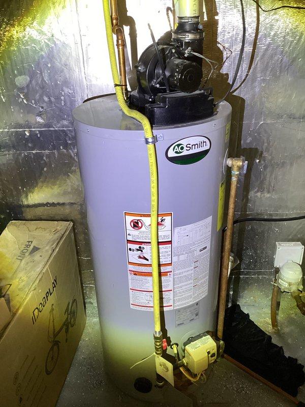 Conducted on-site evaluation for water heater replacement in residential basement utility area. Assessed existing A.O. Smith power vent water heater installation and surrounding conditions. Documented current unit configuration including gas line connections, venting system with blower motor assembly, copper water supply lines, and drainage components. Evaluated installation space constraints and existing infrastructure including concrete block walls with reflective insulation barrier. Prepared comprehensive estimate for replacement with new short 40-gallon power vent water heater, accounting for gas piping modifications, venting requirements, and proper clearances per manufacturer specifications and local code requirements.
