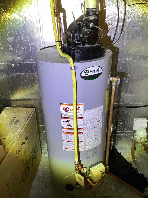 Conducted on-site evaluation for water heater replacement in residential basement utility area. Assessed existing A.O. Smith power vent water heater installation and surrounding conditions. Documented current unit configuration including gas line connections, venting system with blower motor assembly, copper water supply lines, and drainage components. Evaluated installation space constraints and existing infrastructure including concrete block walls with reflective insulation barrier. Prepared comprehensive estimate for replacement with new short 40-gallon power vent water heater, accounting for gas piping modifications, venting requirements, and proper clearances per manufacturer specifications and local code requirements.
