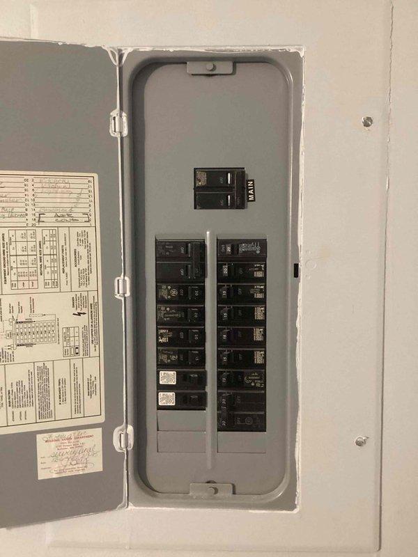 Responded to no power condition affecting multiple areas of residence. Diagnosed and resolved tripped GFCI outlet in upstairs bathroom that was controlling power to basement bathroom. Identified and corrected loose electrical connections at kitchen microwave outlet that were causing breaker trips during appliance operation. Diagnosed faulty light switch in basement living room causing intermittent operation. Reset GFCI protection and verified proper circuit function. Provided estimate for light switch replacement and documented all findings with photographic evidence of electrical panel and affected bathroom area.