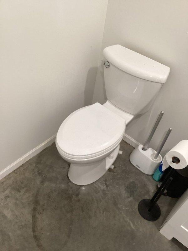 Responded to service call for loose toilet installation. Upon arrival, confirmed toilet was not properly secured to floor flange. Removed toilet from mounting bolts, inspected wax ring and flange for damage, and reinstalled toilet with proper seating and secure bolting to eliminate movement and ensure watertight seal.